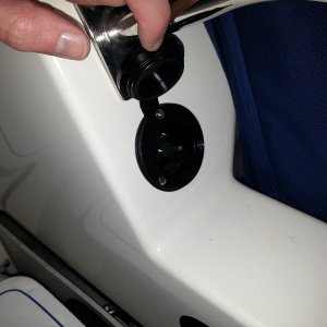 15amp power connection for chargers/shore power.  Just visible, is one end of the GFI strip.  A switch, bus bars, charger, 12v outlet, and combiner also hide in stbd side laz storage along with shore power cord and some spares.
