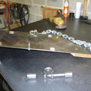bracket uses existing swim bracket bolts to mount,front sits on a strip of teak not bolts to the the boat ,1/4 thick stainless loops on either side have welded bolts the loops used for locking the generator in place to keep it out of the cabin should we leave the boat.
