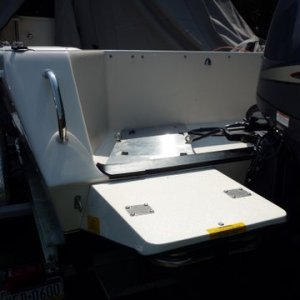 plate installed on existing swim platform bolts, small angles welded to prevent generator from sliding around. will make wood or starboard plate with anti skid to go on plate when generator is not in use.Will also double use as a bait board. Pic's later. Just using generator at anchor stays in cockpit while underway.