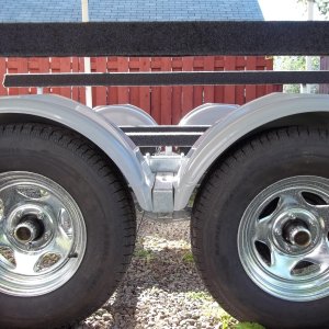 18/09/2011...raised the center fender supports by 2.5 inches,the fenders front and back have alot of tire clearence already.All looks great, you cann't see any alterations.