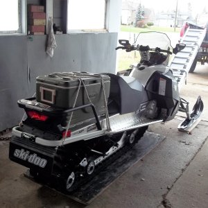 12/3/2015   My fish cooler fits okay . Sled is now at the dealers having the mirrors removed and getting a better travel cover put on and also picking up a storage cover.
