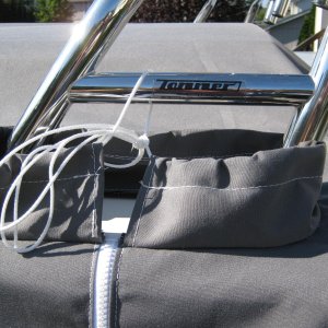 It's actually one piece with two cutouts w/ zippers to go around/under the arch.  Nice quality!
