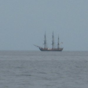 11.) tall ship on horizon