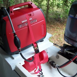 The extended run setup requires the fuel to be drawn only 28in, well within the 36in possible lift according to other posts. With the gen in eco mode, the RPM raises very little when the AC kicks on. The gen is very quiet! The original Honda fuel cap was modified by screwing a 1/4in m-f 90 degree fitting into the cap in place of the vent. Atwood sprayless connectors are used on both ends of fuel line and on both tanks. These connectors seal both the tanks and the fuel line when line is removed. The tie down strap is slightly loosened when the gen is running to allow the engine feet to better cushion the gen.