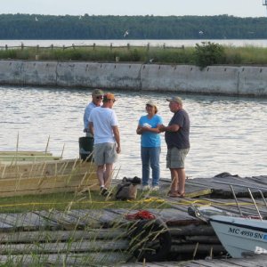 Ira discussing future of Lime Island with Janet, caretaker, and other fishermen.