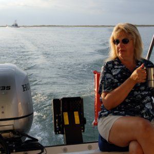 Coffee and dolphin watching on the aft seat (Joan's favorite place on the boat)