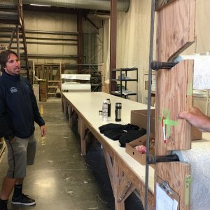 Mark Wright leading the tour, beginning at the pattern cutting table.  With coffee, donuts, and C-Dory swag that was donated for the trivia on Saturday!