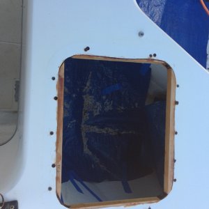 Media 'Hatch removed and filling old holes with epoxy, then drilling oversize and filling new holes before drilling for fasteners.  Inside diameter of new hatch frame is smaller, so shims were epoxied in place.' in album 'Leaky lazarette hatch replacement'