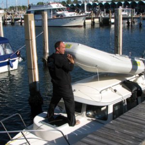 Jeff dumping water out of the dinghy