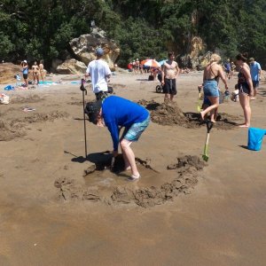 Here I am digging a hole in the sand (everybody brings a shovel).