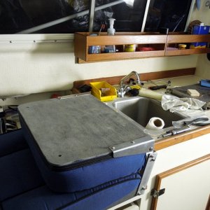 Did the same with this seat as was done on the 22, cut the hinges and attached  cutting board material to the back of the seat.  Don?t really like the look of the back cutting board material so will probable replace with white.