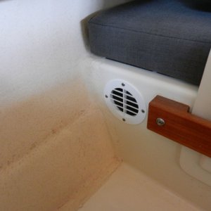 Media 'The two vents allow heat to escape, there is sufficient bilge venting down low for cool replacement air.  This vent in under the dinette table.' in album 'This was the standard Norcold install under the copilot seat.'