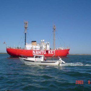 A winning photo showing INN THE WATER along side of the NANTUCKET LIGHT SHIP.