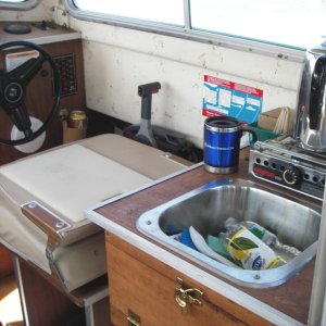 Media 'galley-seat-cutting-board' in album 'Helm with GPS, Compass, and depth finder. Very simple'