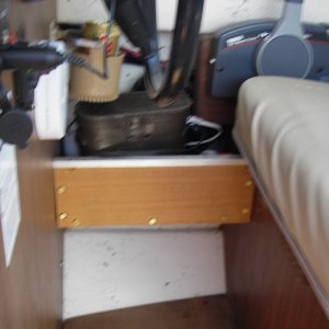 Media 'Shelf next to helm. Storage for binoculars, spot light, and loud hailer.' in album 'Helm with GPS, Compass, and depth finder. Very simple'