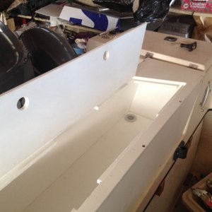 Hinges made from starboard are made so they hold the lid open without a tie back
