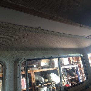 Lori said, there is no place to just put something on this boat without setting it on the table, counter, dash, or seat... So I installed a 6 x 60 inch Port shelf trimmed in teak above the table for just stuff,,,and it already is filling up with just stuff..