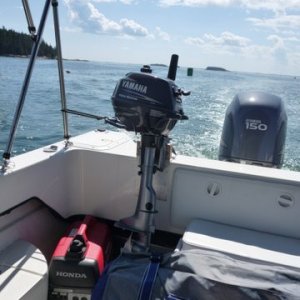 Media 'We lock the motor on to this mount as the two screw clamps that tighten it t the transom have holes for a long shank pad lock' in album 'Junior our 2 1/2 hp Yamaha four stroke dink motor. Bracket through bolted into the compartment with just one bolt.'