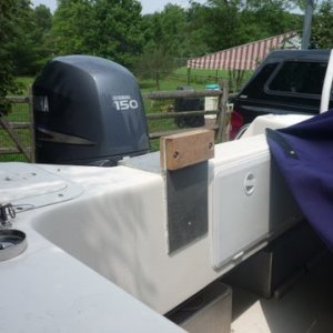 Media 'cockpit side view. Used contact cement and a pleated  white garbage bag on the inside of the mount it just sides down over the motor wells transom. The bare aluminum left black marks on Will-C. No marks now it just slides on or off when we need to carry the dink motor. Our slant back canvas still fits with the dink motor bracket in place.' in album 'Junior our 2 1/2 hp Yamaha four stroke dink motor. Bracket through bolted into the compartment with just one bolt.'