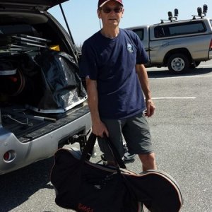 Comes in a carrying bag...weighs 32lbs