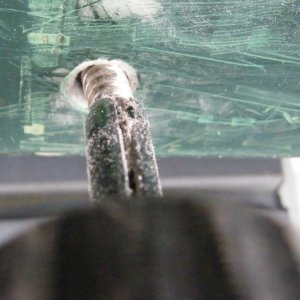 "Unscrew-Um" backing broken screw out of mounting hole.