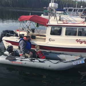 Media 'Jody taking Maggie for a ride on his new Kaboat' in album 'Towing Kevin & Laura of \"Montana Kev\" CD22 Grace on their Sea Eagle kayak back up Yellowstone Lake with our Kaboat'