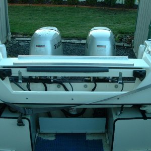(B~C) motorwell tray version 6.0, between the fuel tanks I ran a piece of AL angle and mounted bonus bilge to it, it also protects the fuel filter and trim tab pump from wayward cargo