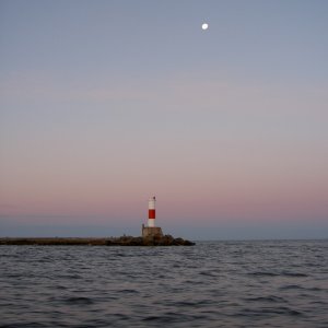 Manistee Light / Lake MI at dawn.  Taken while heading out for salmon on Not For Hire.