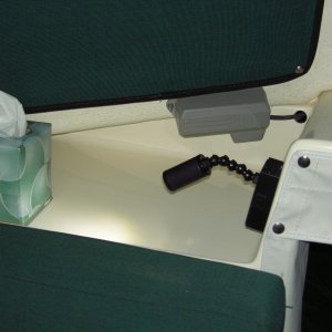 LED swivel reading light mounted on port dash.  Can be used over the shoulder of person sitting at the table or sitting sideways with back against port side.