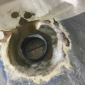 Adding layers of fiberglass for strength.