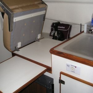 Hinged removable helm seat, slide out counter board, and 1000 W inverter outlet