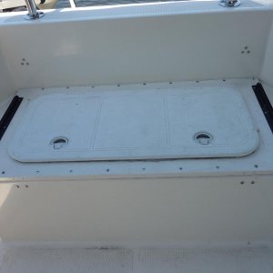 Former live well converted to storage.  Replaced top with watertight hatch.