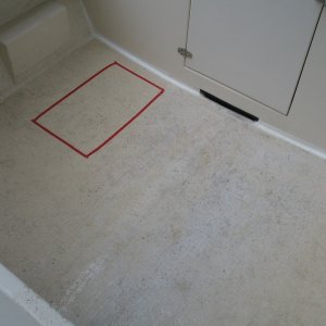 Red outline of area that flexes. Plan to repair in August. Suspecting water damage and or debonding.