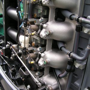 Synchronizing the carbs -- 
Vacuum ports with manifold sealing bolts in place