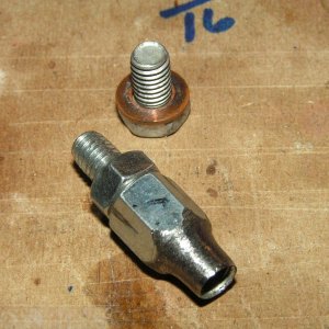 Original 6mm sealing bolt from engine (top). My fabbed vacuum fitting from a 6mm coupler, 6mm bolt cut off with an added nut. Used epoxy on the threads to seal.