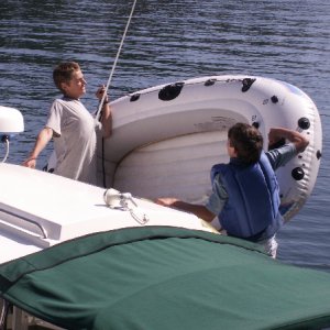Bryce and Tye Hoist the Dinghy at Doe Island 6-27-09