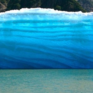 I wished this photo showed the gorgeous colors and moving light that we actually saw.  The sun was shining from the other side THROUGH the iceberg and it was just gorgeous.  And it was about 30 to 40 feet high!