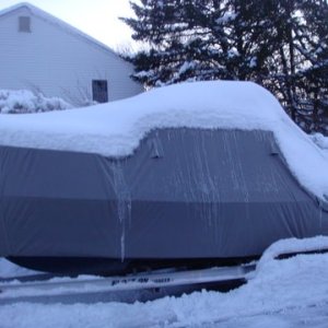 Winter 2010 over 70 inches of snow so far this year we are ahead of Buffalo for total inches of snow. The cover is doing a fine job. Heater inside the boat is keeping it toasty on the inside.