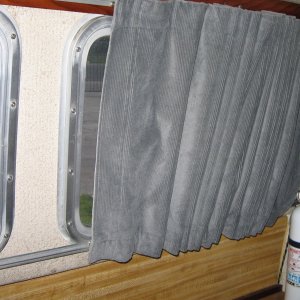 Curtains are made from auto upholstery material.  I wash them in the washing machine, cold water.