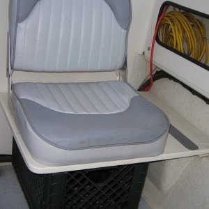 Cockpit seat with 'puddle sucker' bilge pump.