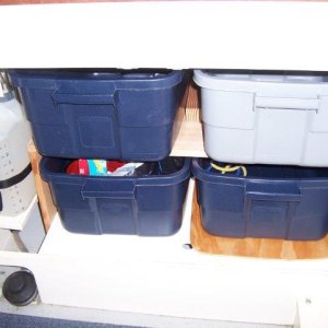 Under Sink Storage Totes. We can pile a lot of stuff in the totes and still keep it fairly organized. Also allows us to pack them in the house and then carry them out to the boat when getting ready for a voyage and returning.