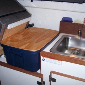 custom made cutting board fits on top of tote for more counter space.