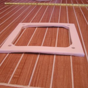 Radar mount plate cut from 1/2" Starboard
11" X 11" bottom carved to fit curve of roof (This is the first one and curve did not work)