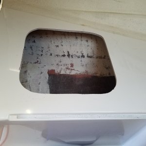 One of two cutouts under the V berth cushions. I traced around the frame, and cut it out with a jig saw, using a metal cutting blade.