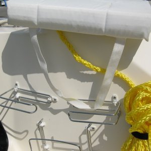 I used one double over the tank toilet paper holder for the bottom. I used two single over the tank paper holders for the sides. I got the holders at WallMart in the plumbing dept. For the line i use double sided velcro.