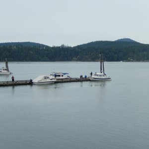 Neil in Rose Bud II (right) and Rob in Robbie's Refuge (center,back), 
at dock in Cornet Bay near Anacortes, WA, 
waiting to cross to Friday Harbor in the San Juan Islands