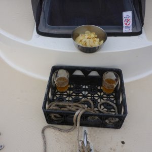 beer o'clock on the bow (even though I have a deck pipe I like letting the chain and rode dry on deck if possible and this little crate locks in place between the center cleat and cabin lengthwise