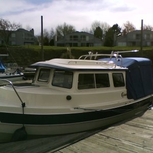 Honu at moorage.  Full camper top.