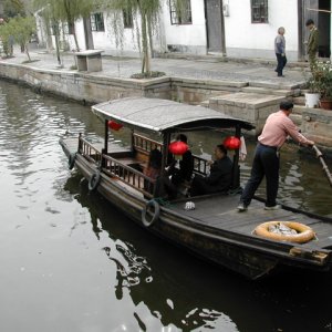 (rogerbum) Dory in Zhujiajiao (a village 30 miles outside of Shanghai).  I estimate that's a 1/4 horse outboard...