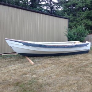 Media 'beautiful hull shape, rolled off trailer no problem' in album 'Cabin removed from hull, took 3 of us to carry it there'